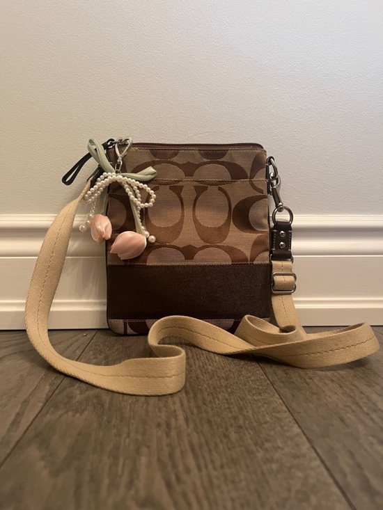 Coach Handbags - Coach Tan and Brown Signature Crossbody Bag with Floral Charm